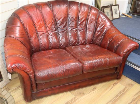 A pair of Tetrad 1970s burgundy leather two seater sofas W.150cm
